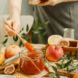 photo with woman in kitchen filling jars with apple marmalade